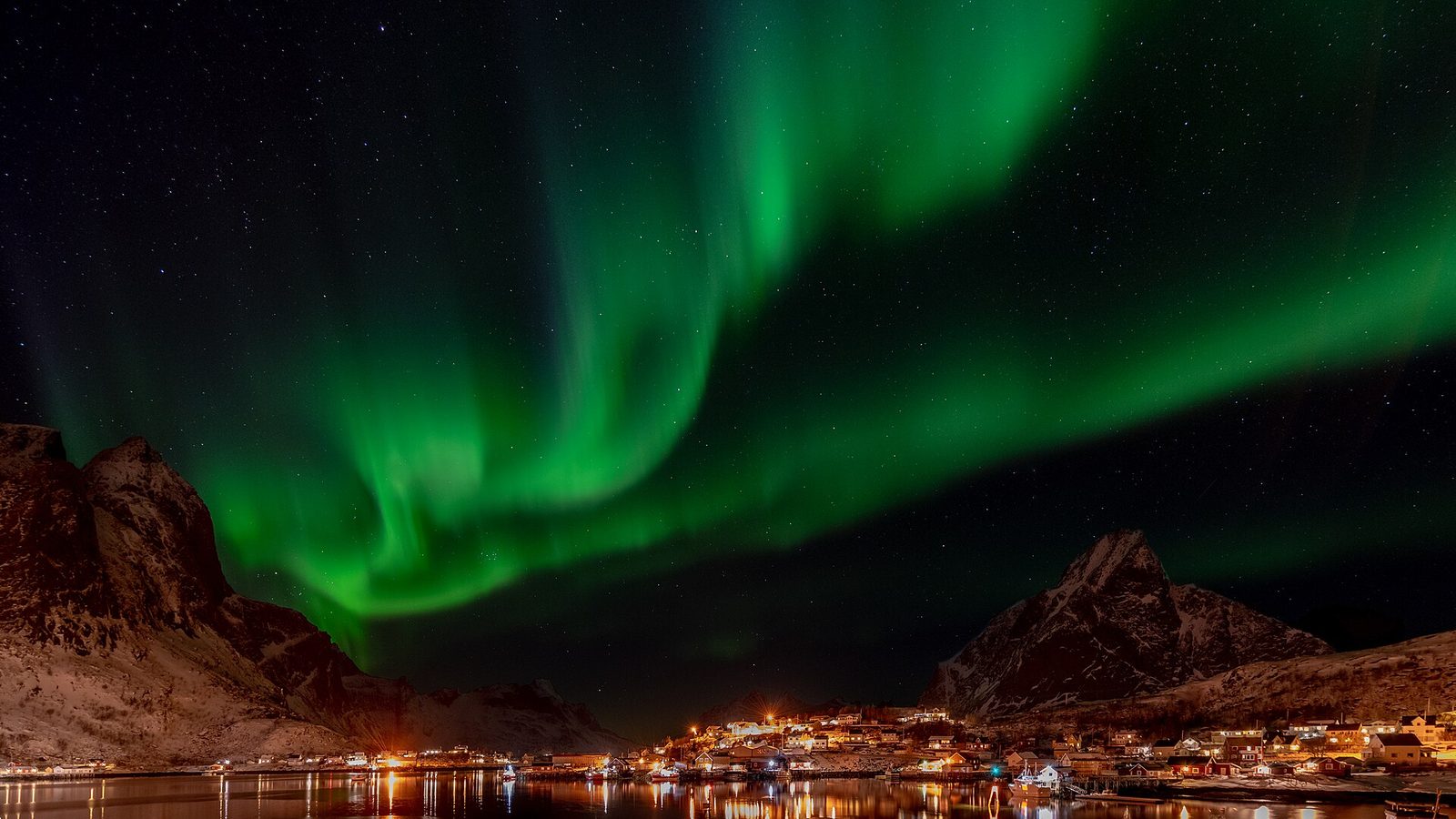 Northern lights over the mountains of Lofoten
